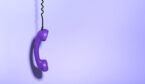 A photo of a hanging purple phone