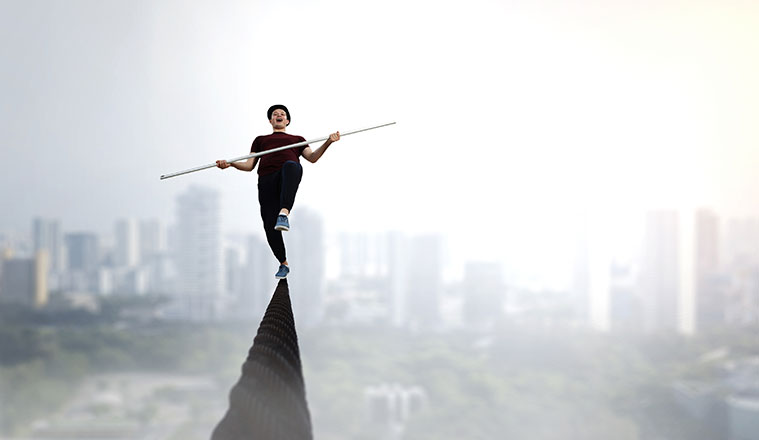 A photo of a tight rope walker