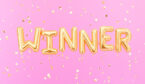 A picture of Winner sign letters with golden confetti.