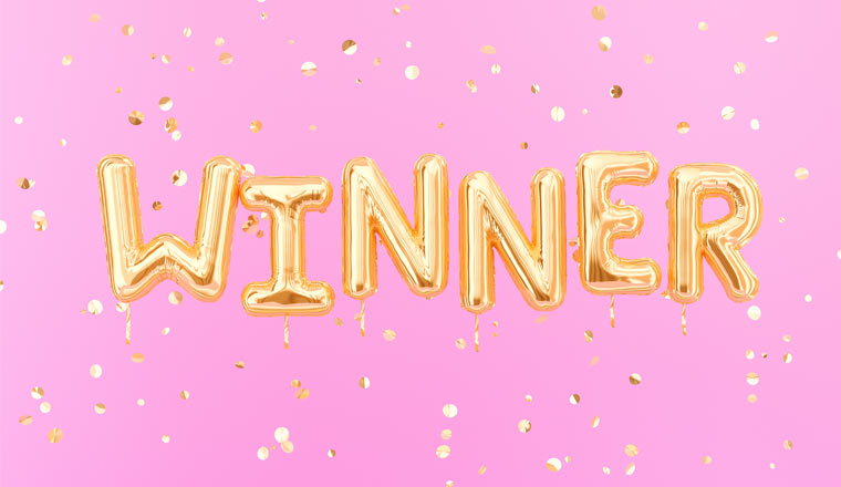 A picture of Winner sign letters with golden confetti.