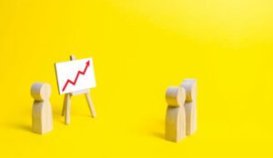 A photo of wooden figures at a chart