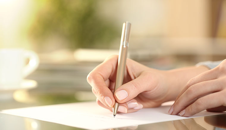 A photo of someone writing a letter