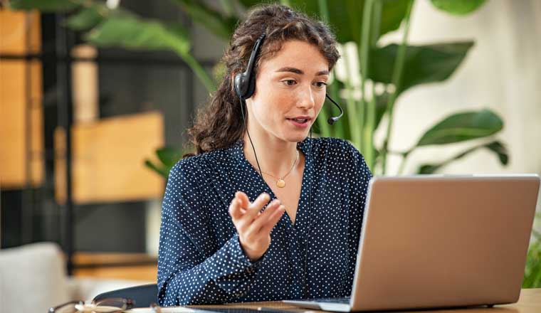 A picture of a remote agent talking to a customer