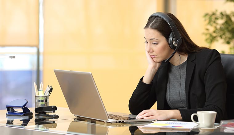 A photo of a bored contact centre advisor