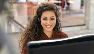 A picture of an agent sat at work desk