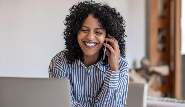 A picture of a happy customer on mobile phone