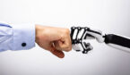 A picture of a robot hand and human hand