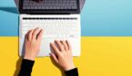 A picture of a laptop from above on a blue and yellow background