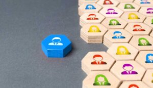 A picture of a blue hexagon with a picture of a person next to a group of wooden hexagons