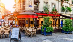 Cozy street with tables of cafe in Paris