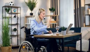 Person on a laptop wearing a headset