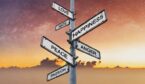 Emotions on directional signpost, with sunrise sky backgrounds