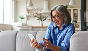 A happy person holding a phone