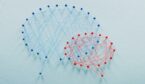 Red and blue speech bubbles made out of pins and string