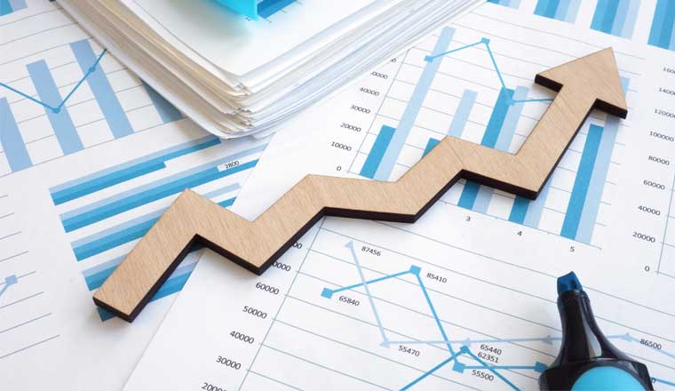 Financial report with graphs and arrow.