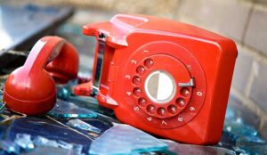 A red phone that has been abandoned