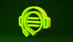 Yellow Headphones with speech bubble chat icon isolated on green background