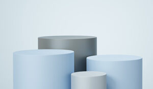 Four different sized cylinders on a light blue background