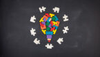 A lightbulb jigsaw on the blackboard