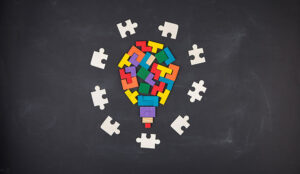 A lightbulb jigsaw on the blackboard