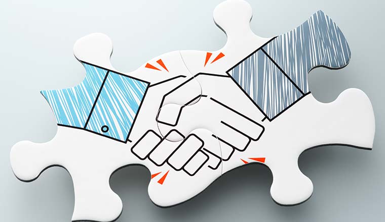 Handshake jigsaw puzzle pieces