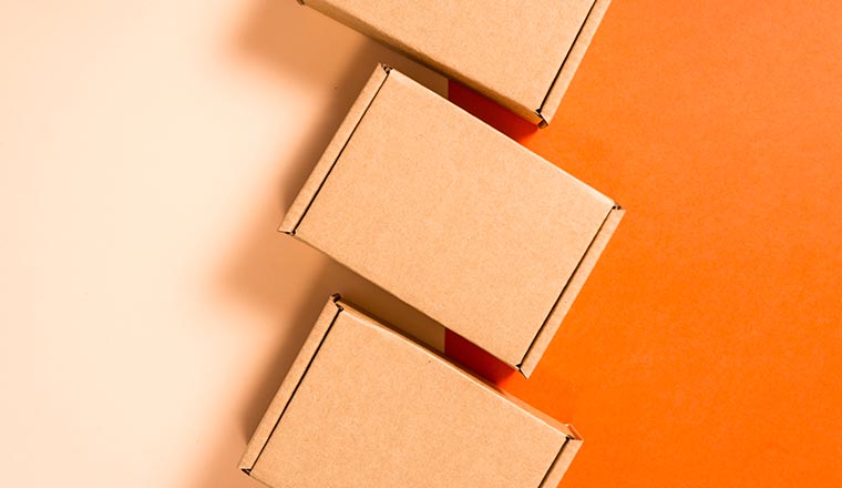 Set of brown cardboard boxes on colorful background