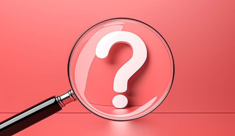 White question mark with magnifying glass on red background