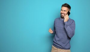 Person on phone isolated on blue background