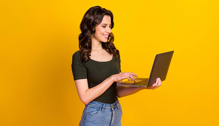Person holding in hand laptop working isolated on bright background