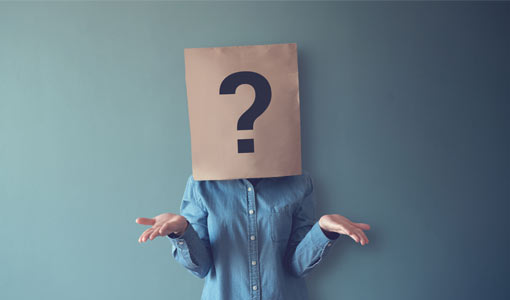 A picture of a person with a brown paper bag with a question mark