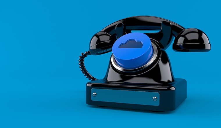 Old telephone with cloud button on blue background