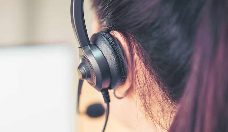 Back view of person wearing microphone headset