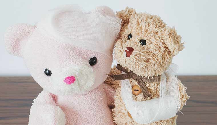 Teddy bear and friend with bandaged head and arm