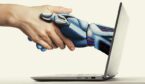 The handshake human with artificial intelligence via laptop