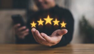 hand of customer or client holding the stars to complete five stars