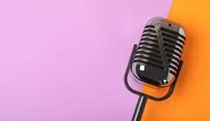 Microphone on coloured background