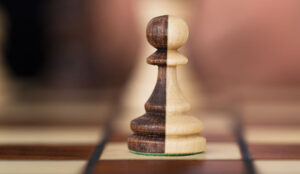 Merged Chess Pawn representing Strategic Partnership