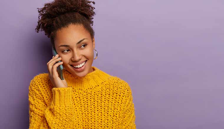 Happy person having positive experience on the phone