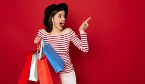 Happy excited lady with many shopping bags