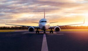 Sunset view of airplane on airport runway