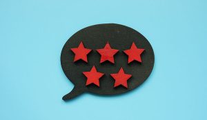 Feedback with five stars as symbol of customer review.