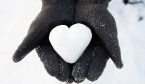 Hands Holding Heart Made Out Of Snow