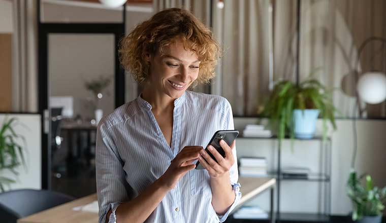 Person using phone in office