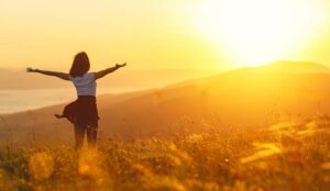 Person celebrating sunset