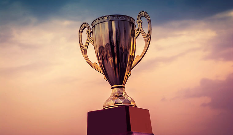 A winner trophy on sky background