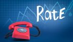 ringing red rotary phone on blurred blue background with line graphs and title 'Rate'.
