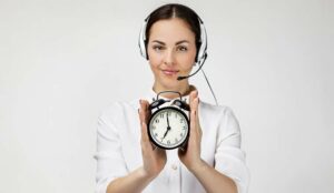 Call centre agent holding clock acpt