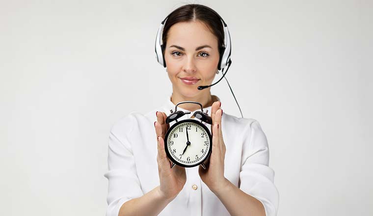 Call centre agent holding clock acpt