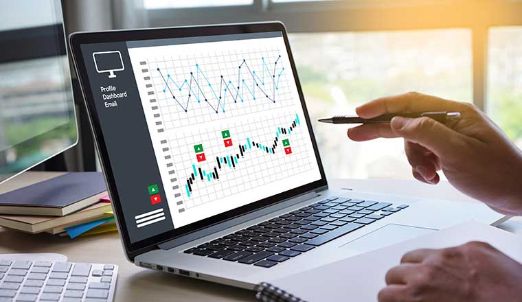 laptop showing forecast on screen