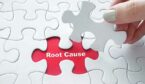 puzzle piece being lifted to reveal the words root cause